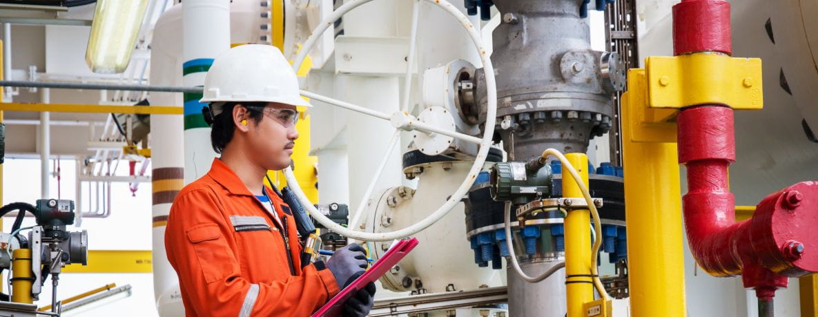 An engineer inspecting machinery